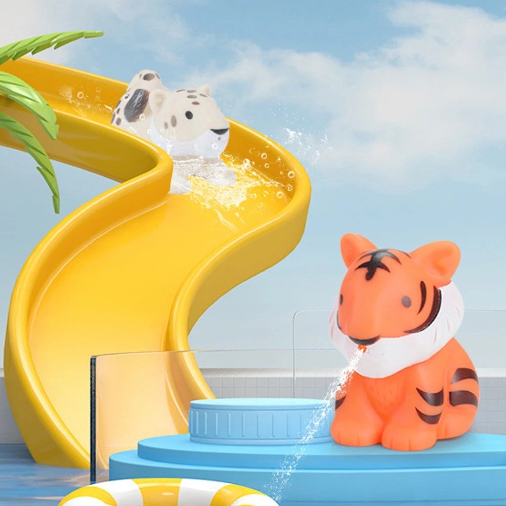 tygrys oraz leopard z gumowych zabawek do kąpieli - zwierząt - na żółtej małej zjeżdżalni